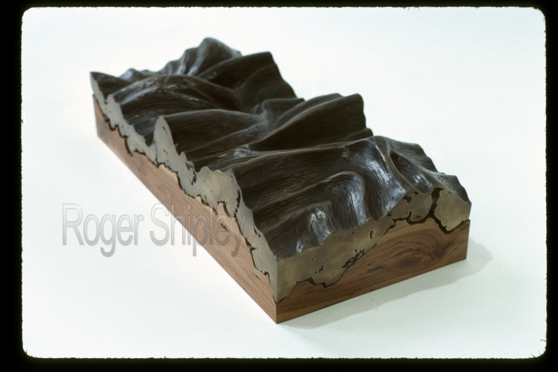 PP57, 3 qtr view, 18x8x4 inches, cast bronze and black cherry wood, 1985.jpg